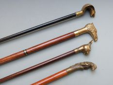 Four walking canes with novelty handles including parrot, snake and eagle