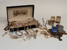 A collection of costume jewellery to include paste necklaces, brooches, coins etc