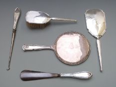 Hallmarked silver mounted hand mirror and matching brush, hallmarked silver handled button hook