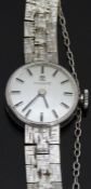 Tissot 9ct white gold ladies wristwatch with black hands and baton markers, silver dial and signed