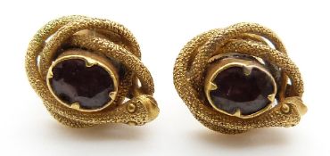 A pair of Victorian earrings set with foiled garnets surrounded by snakes with textured detail