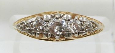 An 18ct gold ring set with five diamonds, the centre diamond approximately 0.2ct (size J)