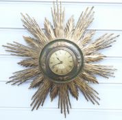A retro 1960/70s sunburst clock, brass Roman dial with central engine turned decoration, 42cm