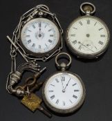 Three silver pocket watches all with black hands and Roman numerals, white enamel dials and engraved