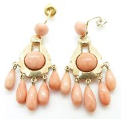 A pair of 9ct gold earrings set with five pear drop coral beads and two coral cabochons to each,
