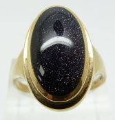 A 9ct gold ring set with faux purple sunstone, 7.6g (size X)