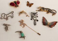 Butler & Wilson brooch in the form of a raccoon, other brooches including a dog, butterflies,