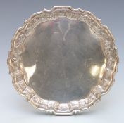 Eastern Burmese or Indian white metal tray with shaped edge and decoration of animals and buildings,