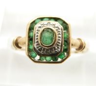 A 9ct gold ring set with emeralds and diamonds in an Art Deco style, in original box (size K/L)