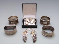 Four various hallmarked silver napkin rings, weight 88g together with a hallmarked silver napkin