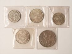 1935 George V 'rocking horse' crown, F+ together with a 1928 florin and three George VI coins,