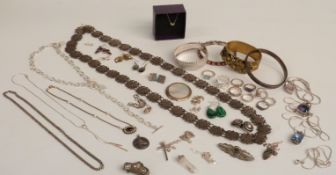 A collection of silver jewellery including flapper bangle, silver chains, pendants, earrings, silver