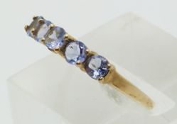 A 9ct gold ring set with tanzanites (size P)