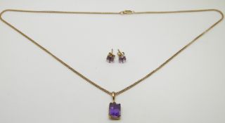 A 9ct gold necklace set with an amethyst and a pair of similar earrings