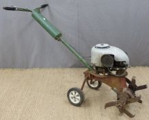 Vintage petrol garden rotavator with Villiers or similar engine and petrol tank built into the