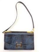 A vintage crocodile handbag by Selfridges