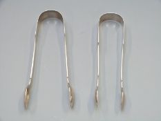 Two pairs of Georgian hallmarked silver sugar tongs, London 1827 and Exeter 1825, length 15cm,