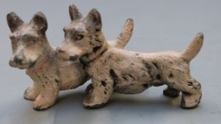 Austrian painted model of two dogs, marked Austria to underside of one dog, length 7cm