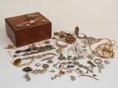 A collection of costume jewellery including a white metal bangle, mother of pearl pig charm, Art