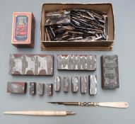 A very large collection of pen nibs together with two bone pens, a box for a bottle of Le Page's