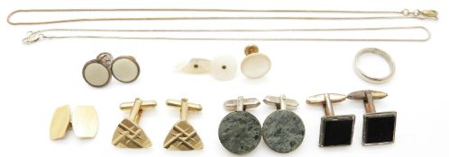 A collection of cufflinks including silver and two silver chains