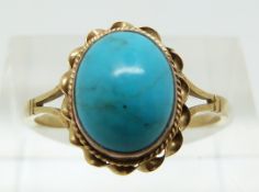 A 9ct gold ring set with a turquoise cabochon (size N)