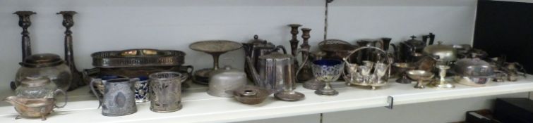 A large quantity of silver plated ware including pairs of candlesticks, sauce boats, trays etc