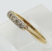 An 18ct gold Art Deco ring set with old cut diamonds in a platinum setting (size M)