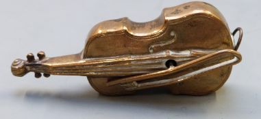 Novelty sewing tape measure in form of a cello with bow as the winding handle, length 6.5cm