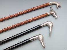 Four walking canes with novelty handles to include three birds and one fish