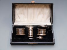 George V hallmarked silver three piece cruet set, Bimringham 1934 maker Adie Brothers, in original