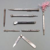 Four hallmarked silver and white metal propelling and retractable pencils including one with ruler