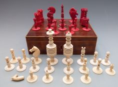 A 19th century turned and carved bone harlequin chess set comprising 37 various pieces, height of