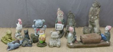 A quantity of garden gnomes and similar garden figures