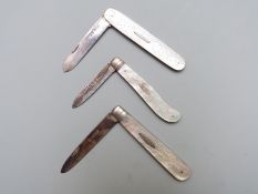 Three hallmarked silver bladed mother of pearl folding fruit knives comprising Sheffield 1891,