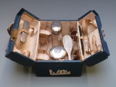 Asprey blue leather cased travelling set, with hallmarked silver mounted brushes, London 1921, the