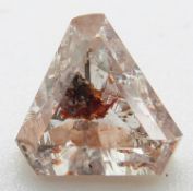A loose cut diamond with an unusual inclusion shown to the table facet, 0.28g