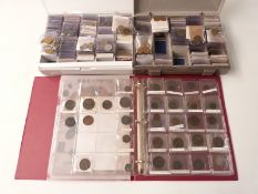 A large collection of world coinage mostly in two indexed 'Coinstor' collectors' lidded trays,