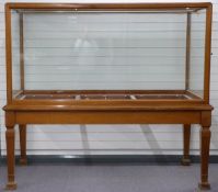 Early to mid 20thC mahogany museum or similar display cabinet with doors to each end, raised on