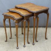 Nest of three burr walnut topped tables, largest width 54cm