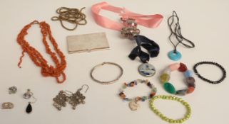 A collection of jewellery including pearl bracelet, Victorian chain, coral necklace, silver rattle
