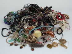 A collection of costume jewellery including beaded necklaces, tiger's eye, etc
