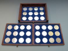 Thirty-six hallmarked silver crown-size medallion coins representing churches and cathedrals in