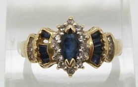 A 14ct gold diamond ring set with a marquise cut sapphire and diamonds (size M)