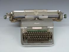 Olympia typewriter and guillotine paper cutter