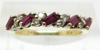 An 18ct gold half eternity ring set with rubies and diamonds (size K)