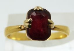A 22ct gold ring set with paste