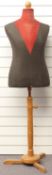 A vintage tailor's dummy raised on a wooden stand, height 153cm