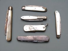 Three hallmarked silver bladed mother of pearl folding fruit knives, two further mother of pearl