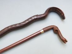 Two walking canes with novelty carved snake handles